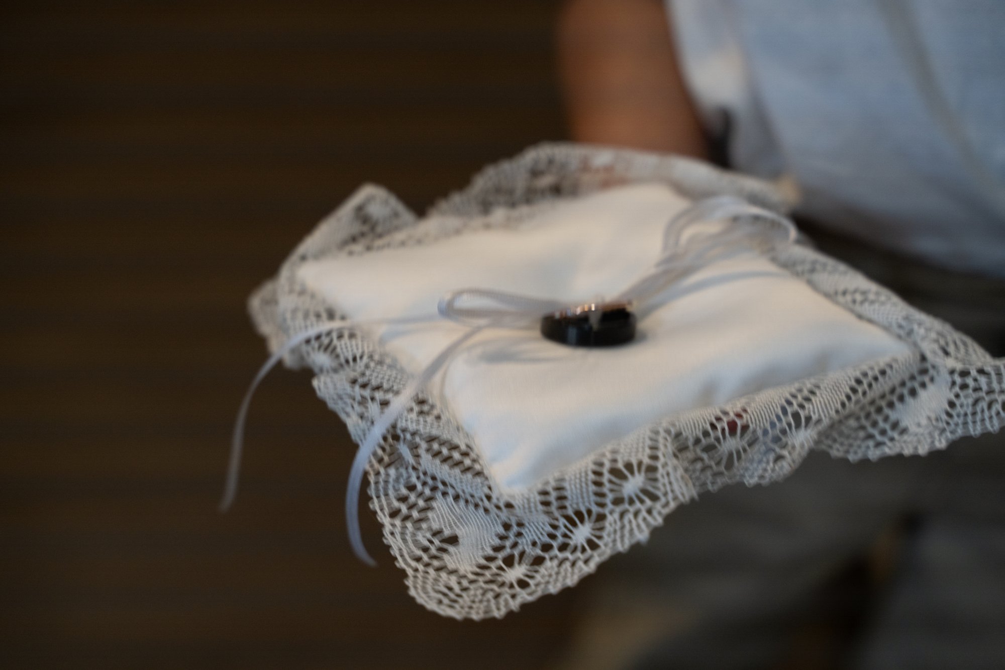 The same wedding ring bearer pillow photo with the LED banding completely removed by BANDing AID